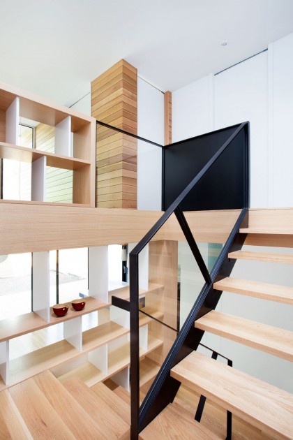 Easy Geometrical Arrangement Of Blonde Wooden Staircase With Shelves Attached To The Left Architecture