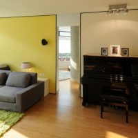 Interior Design Modern Piano With Dark Furnishing Of The Desk Near The Living Room 495x630 Bright-Living-Room-with-Yellow-Paneling-as-the-Divider-726x630