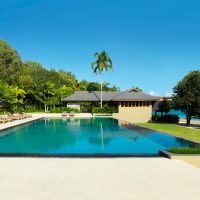 Resort & Villa Stunning Pool With Green Field Theme 972x507 Awesome-Living-Room-with-Wooden-Accent-of-the-Ceiling-and-Floor-775x630