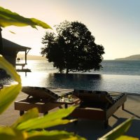 Resort & Villa Sunbathing Area Located In The Edge Of Pool 472x630 Minimalist-Bedroom-with-White-Bedding-and-Wooden-Touch-840x630