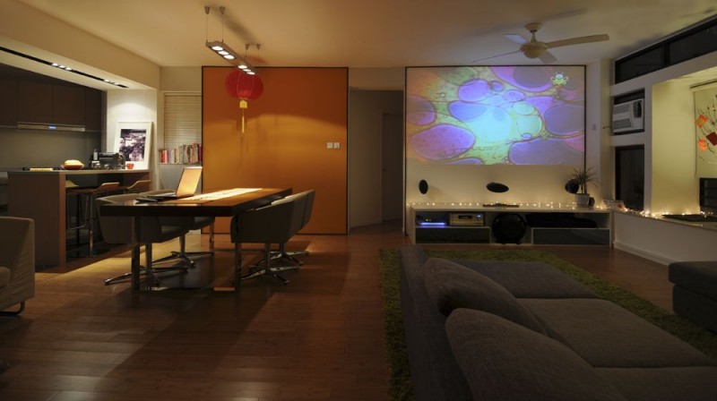 The Media Room Near The Living Room With Sparkling Lighting On Desk Of Large Screen Interior Design