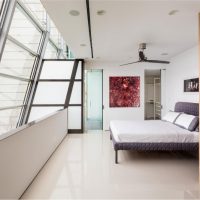 Resort & Villa Thumbnail size White Luminous Bedroom With Grey Bed And Pop Arts Hanging Overlooking The City Sky