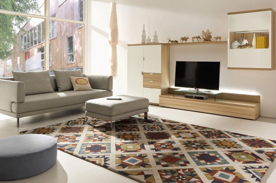 Careful Color Choices Invites Into Living Room With Futuristic Rugs And Minimalistic Tv Setup 560x371 Living Room