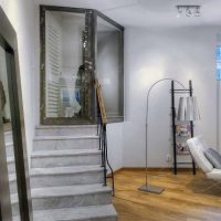 Apartment Secret Area With Mini Stairs Beside Living Room 560x371 Minimalist-Modern-White-Work-Desk-with-Purple-Unique-Chairs-560x371