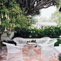 Furniture White Patio Garden Terrace Furniture Sets With Trumpet Flower Tree 560x658 Amazing-Pool-with-Cream-and-Black-Cabana-560x672