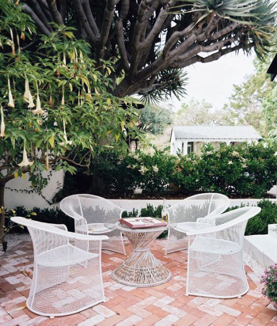 Furniture White Patio Garden Terrace Furniture Sets With Trumpet Flower Tree 560x658 Astonishing Beautiful Terrace and Poolside Furniture Sets Inspirations